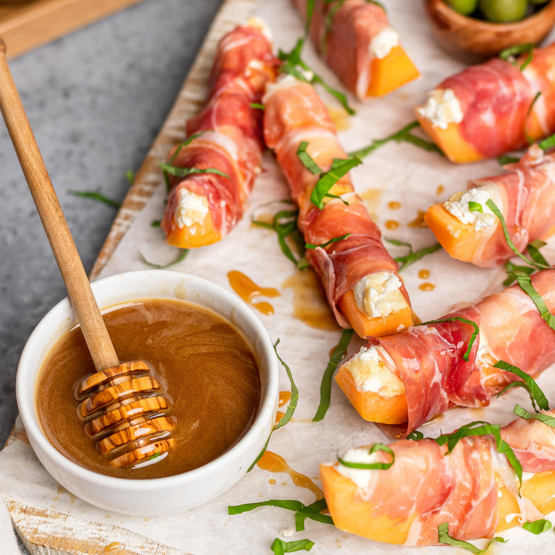 Prosciutto & Ricotta Wrapped Melon with Calabrian Pepper-Infused Honey