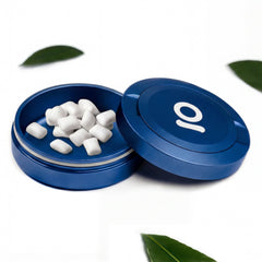 ONGROK Pouch Storage Puck in blue, lid off and base filled with white pouches