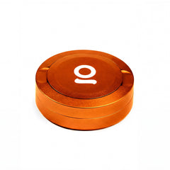 ONGROK Pouch Storage Puck in orange, closed, angled view of the logo lid