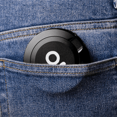 ONGROK Pouch Storage Puck in black tucked into a jeans pocket