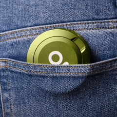 ONGROK Pouch Storage Puck in green tucked into a jeans pocket