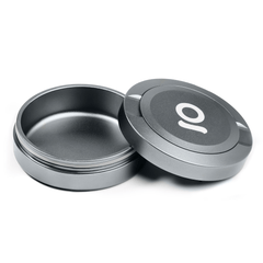 ONGROK Pouch Storage Puck in gray, open and empty with the lid leaning on the base