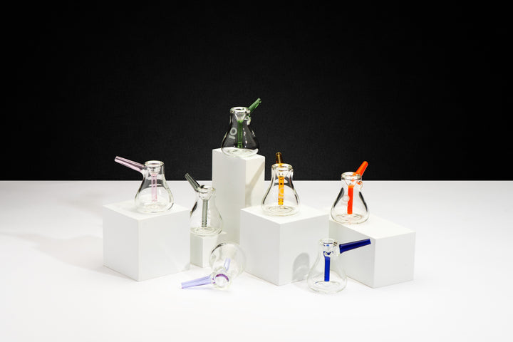 ONGROK Scandinavian Pocket Bubbler in seven colors on white blocks against black, mouthpieces in each color