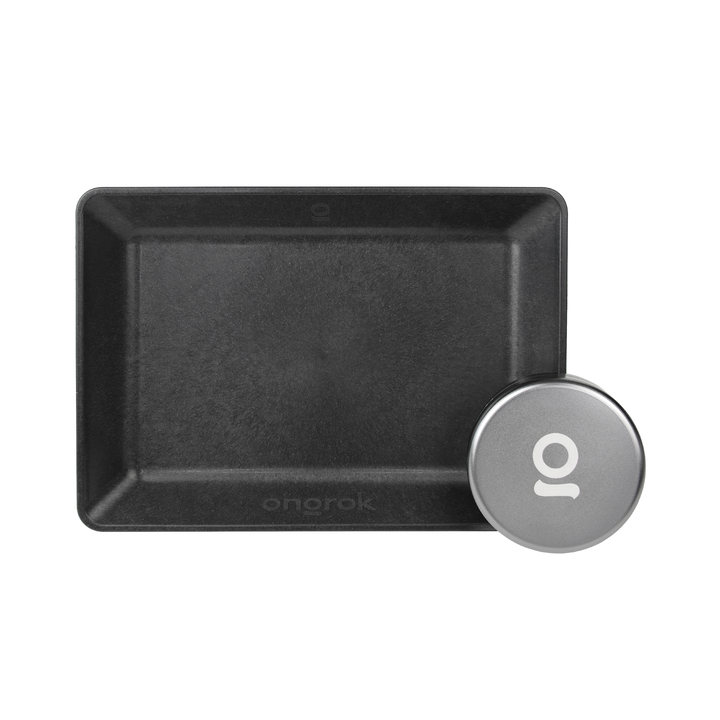ONGROK Eco-Tray and Storage Puck set: black plant-based rolling tray with the silver aluminum puck in one corner